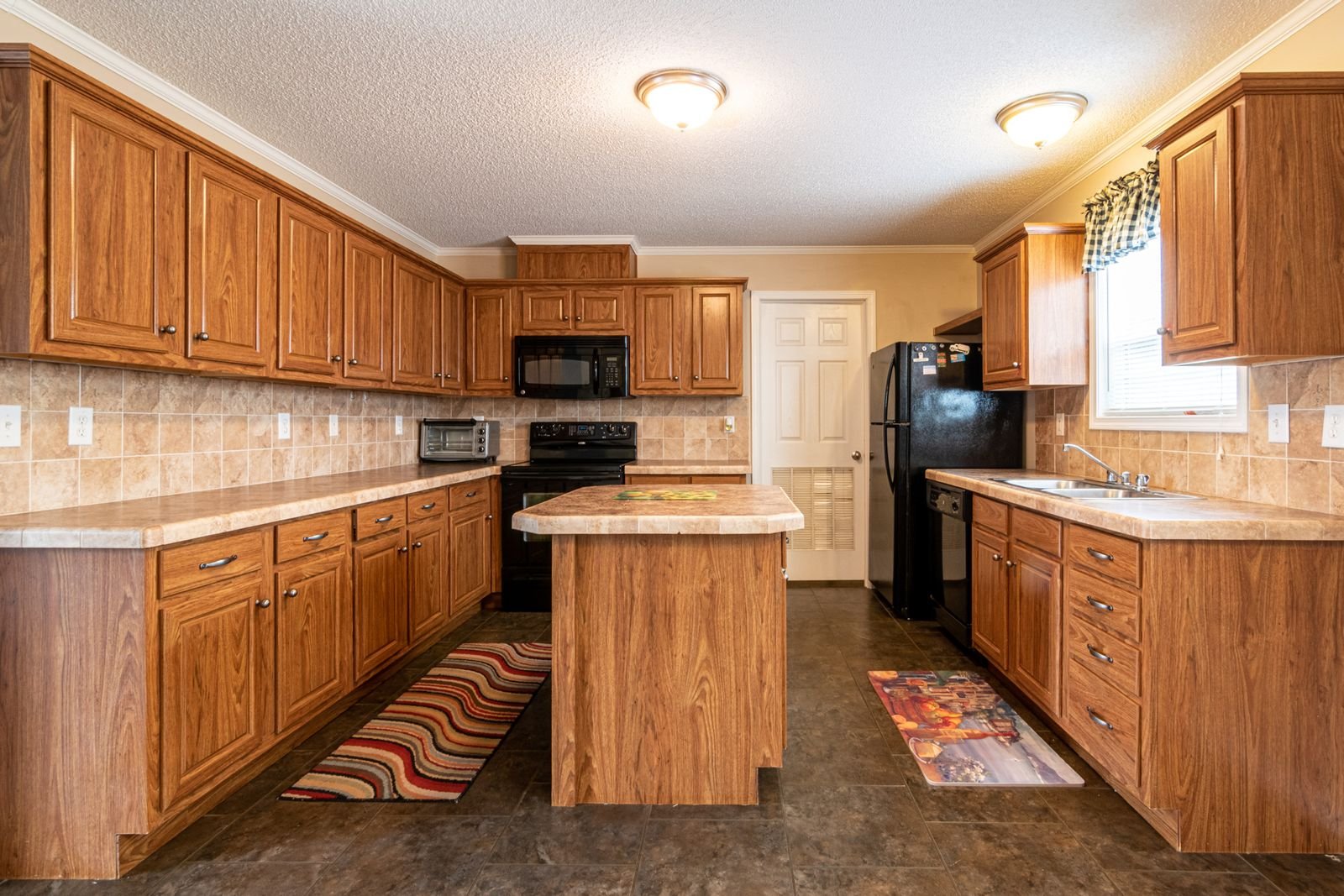 Kitchen with warm timber cabinetry